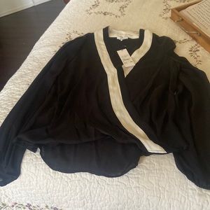 Black and white blouse by Parker L.🍄